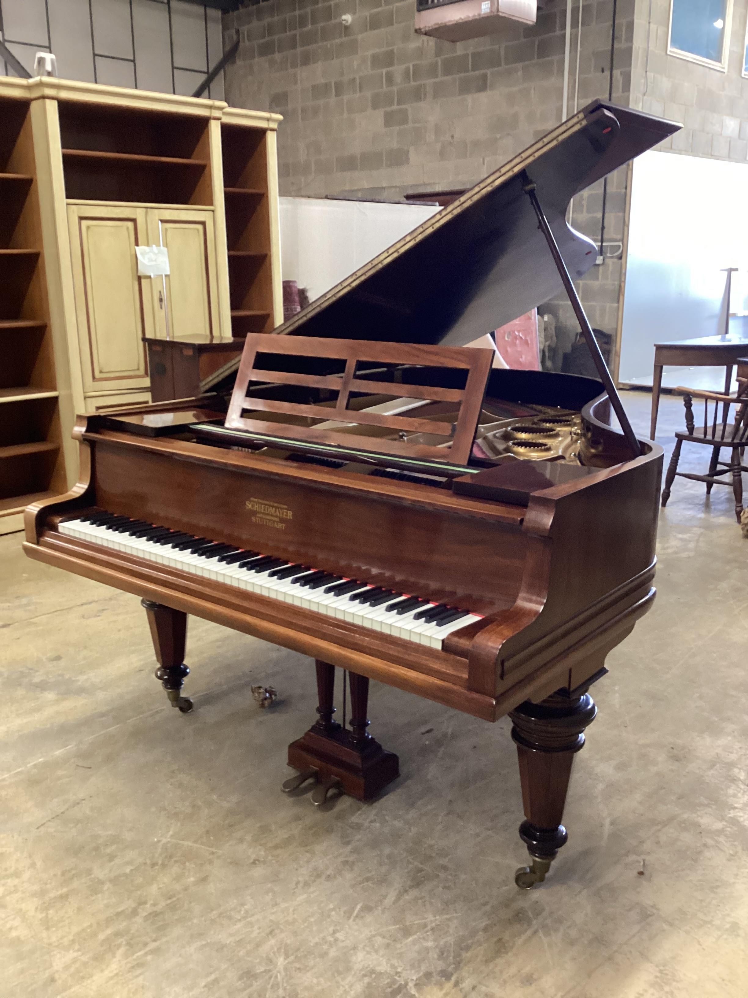 A Schiedmayer rosewood grand piano, circa 1935, length 194cm, width 152cm, height 99cm closed, together with a modern hinged box seat piano stool CITES Submission reference 2JRHUCGB